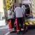 Two German paramedics load a person into an ambulance