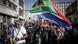 Protesters hold sticks and flags while chanting slogans as they march during a demonstration by the "March and March" and Operation Dudula movements marking an unofficial deadline set by citizen-led groups for undocumented foreign nationals to leave South Africa, in Johannesburg Protesters hold sticks and flags while chanting slogans as they march during a demonstration by the "March and March" and Operation Dudula movements marking an unofficial deadline set by citizen-led groups for undocumented foreign nationals to leave South Africa, in Johannesburg