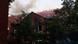 Fire buring in roof of red brick building Fire buring in roof of red brick building