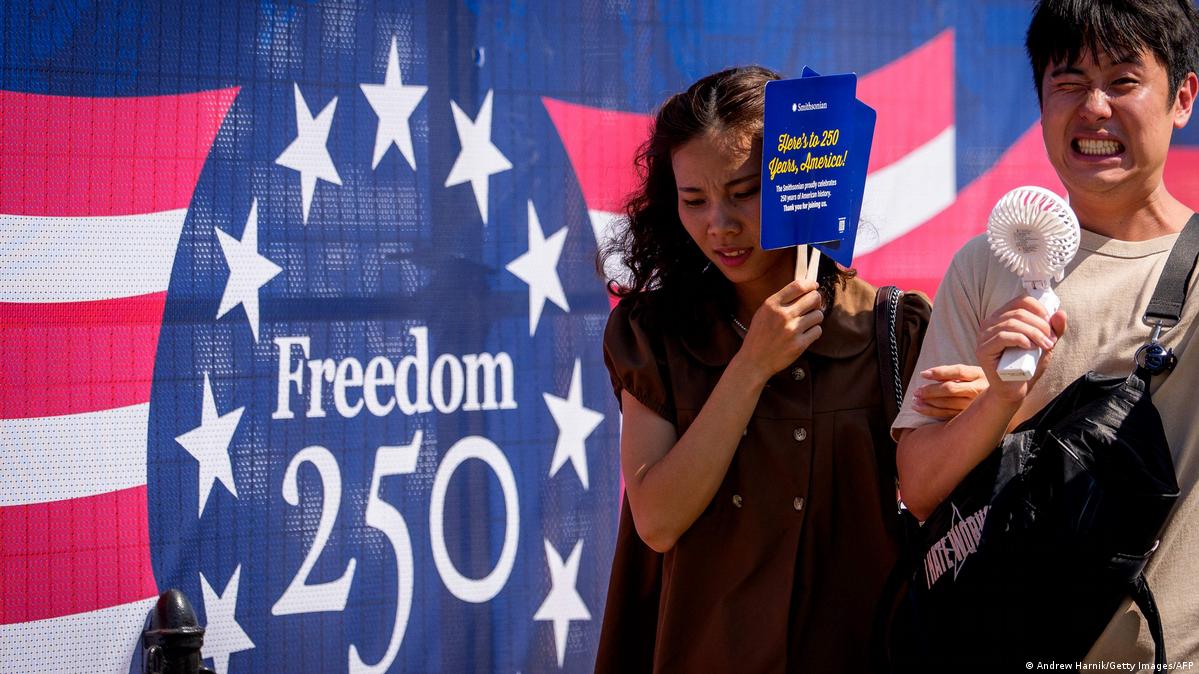 Visitors try to stay cool as they walk along the National Mall as the nation celebrates America's 250th anniversary on July 03, 2026, in Washington, DC