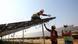 Workers install solar panels at the Pavagada Solar Park 175 Kilometers north of Bangalore, India, March 1, 2018. Workers install solar panels at the Pavagada Solar Park 175 Kilometers north of Bangalore, India, March 1, 2018.