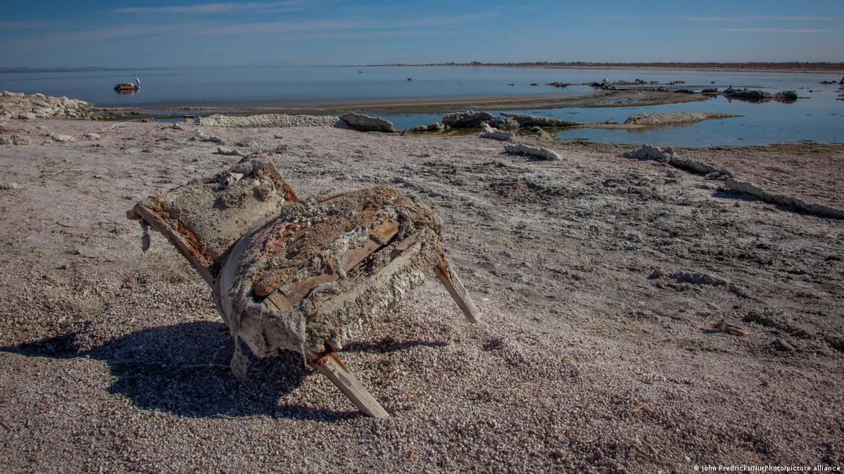 An old chair, once covered by water, now visible as the lake has retreated, Salton Sea, Imperial County, California