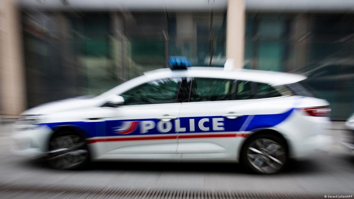 A picture taken with a zoom effect shows a police car in front of a police station in Paris, France, on August 20, 2018