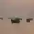 Vessels are anchored in the Strait of Hormuz as seen from Musandam, Oman, June 3, 2026