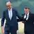 German Chancellor Friedrich Merz (l) and French President Emmanuel Macron smiling as they arrive for the Franco-German Defence and Security Council (CFADS) meeting at the Noervenich air base, July 17, 2026