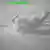 Black-and-white photo of smoke rising from an apparent explosion