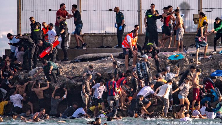 Spain scrambles after thousands of migrants breach the border of the Spanish enclave of Ceuta; many enter from Morocco
