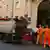 Garbage workers load a truck in Rome, Italy (September 2021)