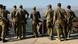 Israeli soldiers look towards Lebanon from the Israeli side of the Israel-Lebanon border