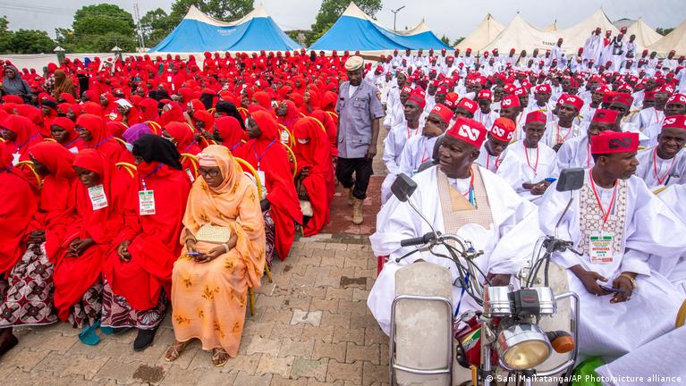 Nigerian brides in red hijabs at Kano state sponsored mass wedding ceremony August 2026 with 1500 couples married in single weekend