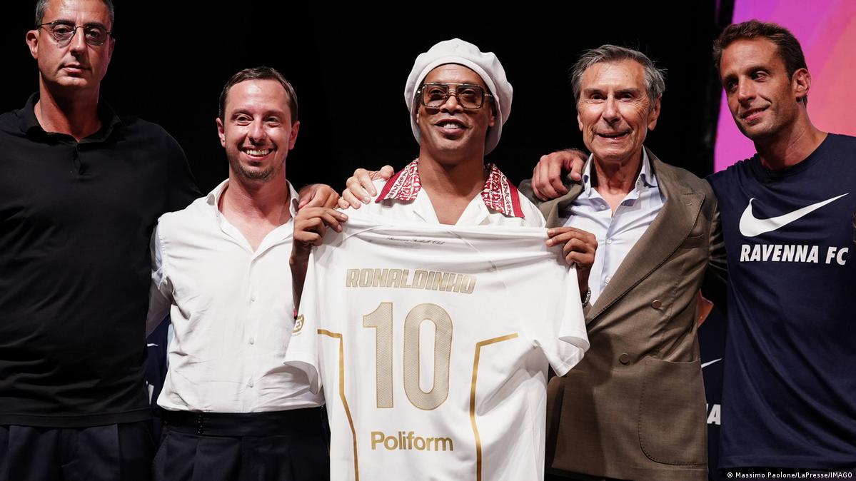 Ronaldinho holds up his new jersey at Ravenna FC