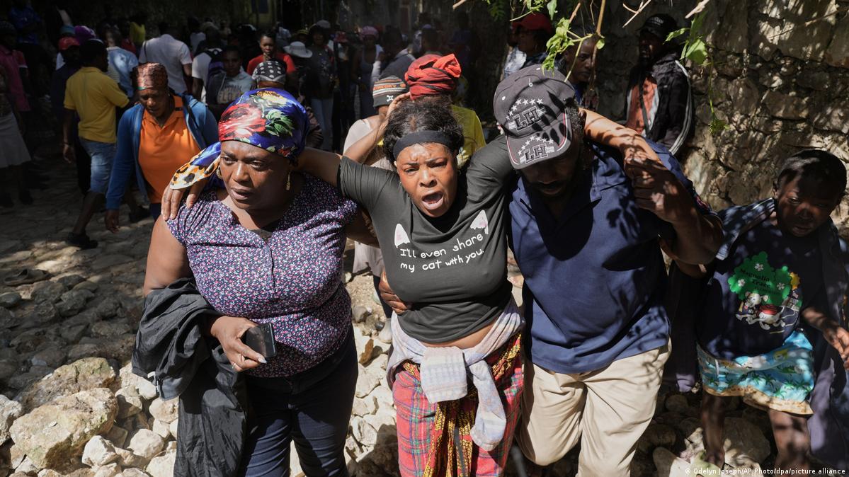 Victims of a gang attack are being transported away
