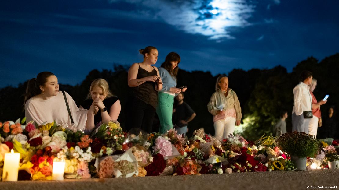 Well wishers gather during a night vigil for King Harald V