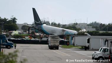 Image 13: An Amazon cargo plane is seen after it crashed at Miami International Airport on September 06, 2026 in Miami, Florida, US