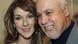 A cantora canadense Céline Dion sorri ao lado do empresário e marido, René Angélil em 2002