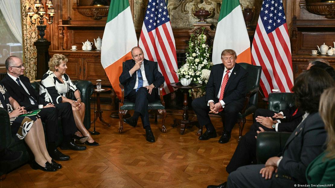 Micheal Martin and Donald Trump with others in room with parquetry