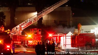 Image 11: Firetrucks and smoke seen at a helicopter accident 