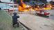 Ukraine Kharkiv, May 2025 | A Suspilne reporter films a market in flames after a Russian strike.