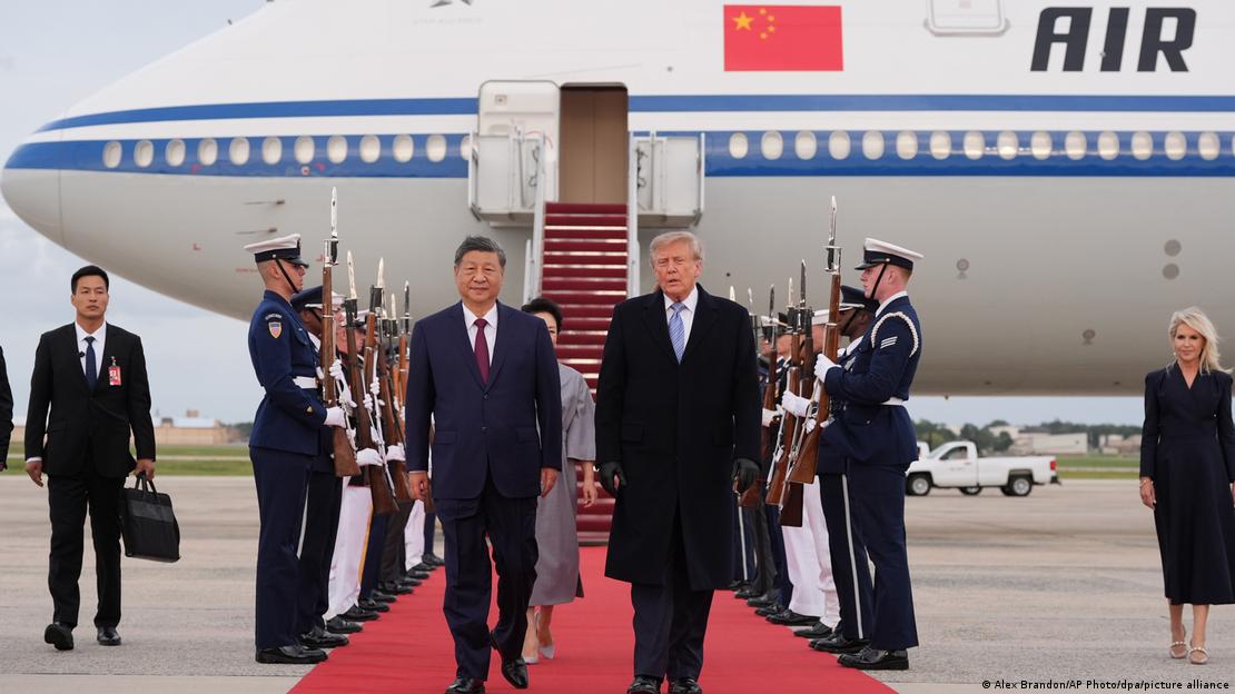 Xi Jinping and Donald Trump walk a red carpet