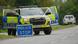 Image 3: Police guard a road leading to RAF Fairford, a US air base, after an incident in Fairford, England