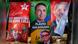 Tres coloridas toallas con imágenes de Lula y Flávio Bolsonaro.