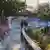 People walk along the remains of the bobsleigh track in Sarajevo