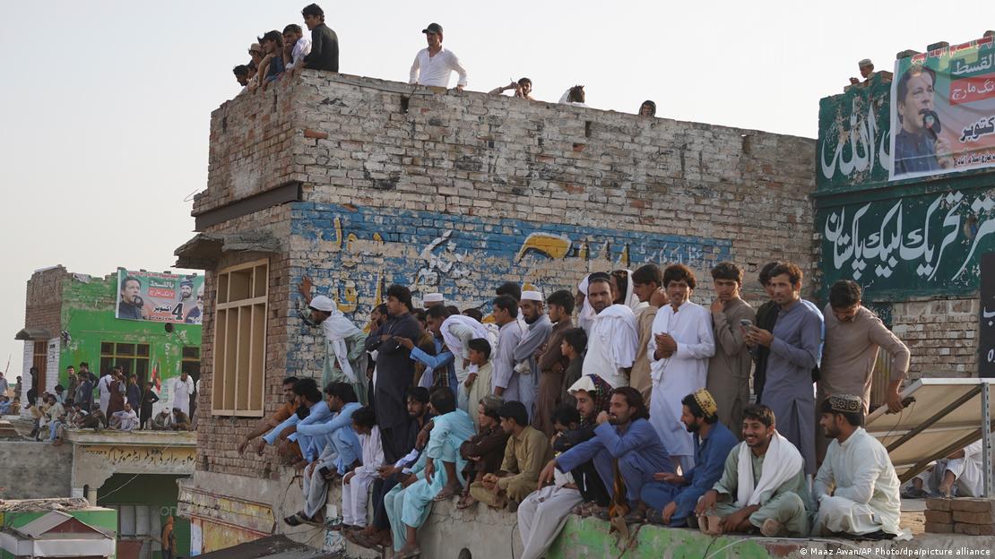 Imran Khan supporters gather on a rooftop in Lakki Marwat before embarking on a protest march to the Pakistani capital on October 4, 2026