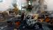 A resident with a dog looks on at the site of private car garages hit by a Russian missile strike,