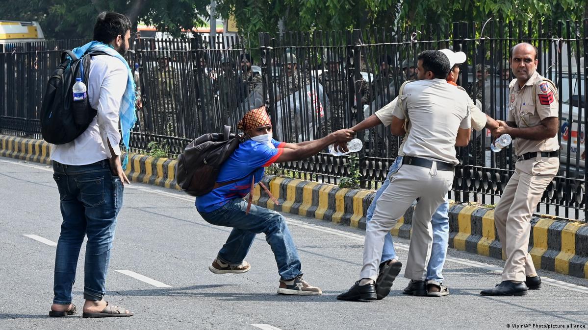 Indian police crack down on 'Cockroach' protest in Delhi