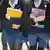 Female students wearing school uniforms of skirts and stockings carry school books in the UK