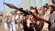 A fighter loyal to the Houthi authorities, brandishes his weapon during a rally to recruit more fighters, in Sanaa on October 7, 2026 A fighter loyal to the Houthi authorities, brandishes his weapon during a rally to recruit more fighters, in Sanaa on October 7, 2026