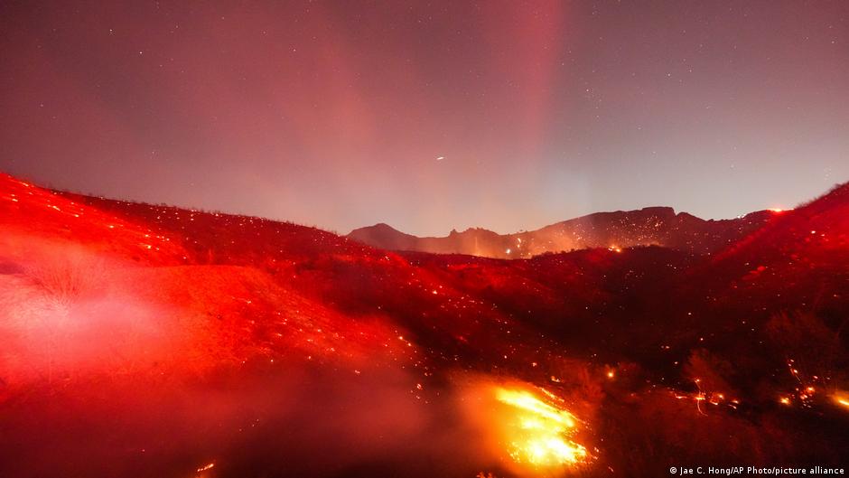 Strong winds fuel fires near Los Angeles as the region recovers from last year's deadly blazes