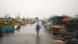 A man walks past docked boats along the harbor amid rain and gusty winds as Cyclone Arnab approaches, in Visakhapatnam, Andhra Pradesh, India, October 27 A man walks past docked boats along the harbor amid rain and gusty winds as Cyclone Arnab approaches, in Visakhapatnam, Andhra Pradesh, India, October 27