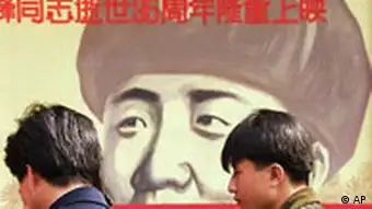 Chinese wait outside a movie theater featuring a poster promoting a movie about Lei Feng, a soldier in the 1960's who was promoted to hero and model soldier status by Chinese authorities, in Beijing Wednesday, March 5, 1997. Propagandists still use Lei as an example of selflessness and annually carry out 'Learn from Lei Feng' campaigns. Most Chinese believe that Lei died when he backed his truck into a pole, but the new film claims to reveal the true story - that one of Lei's comrades backed into the pole, causing it to fall on Lei. (AP Photo/Greg Baker)